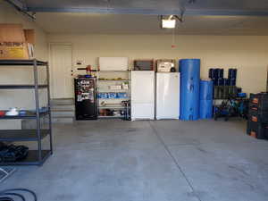 Garage featuring a garage door opener