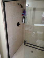 Bathroom featuring a shower with shower door