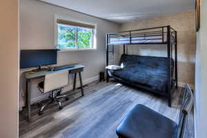 Bedroom featuring wood-type flooring