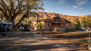 View of front of home with a porch and a mountain view