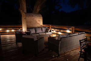 Deck at night with outdoor lounge area