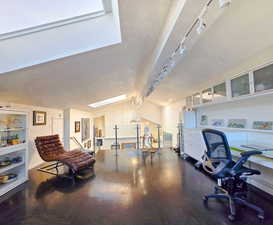 Studio / Office Space with natural light from skylight. Featuring a sink, a view of the Mountains and Valley to the South, and lofted ceiling with beams and dark hardwood / wood floors