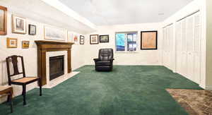 Unfurnished room featuring a fireplace, and rail lighting with East Window