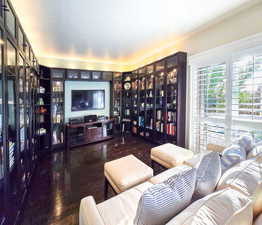 Media / Library room featuring ceiling fan with a view to West Deck