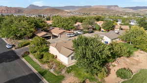 Birds eye view of property with a mountain view