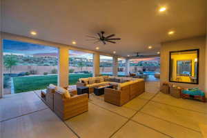 View of patio with outdoor lounge area and ceiling fan