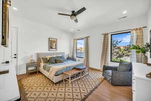 Bedroom featuring ceiling fan and light hardwood / wood-style floors