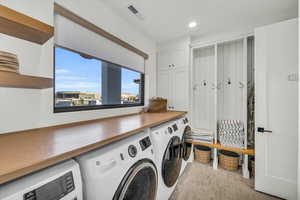 Washroom featuring washer and clothes dryer