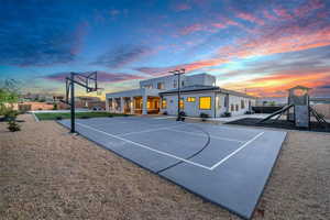 View of basketball court featuring a playground