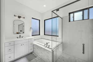 Bathroom with tile patterned flooring, vanity, and plus walk in shower