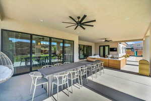 View of patio featuring ceiling fan and outdoor lounge area