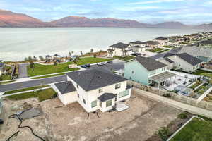 Birds eye view of property featuring a water and mountain view