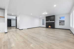 Unfurnished living room featuring light hardwood / wood-style flooring