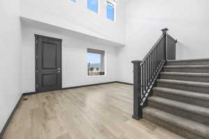 Foyer entrance featuring light hardwood / wood-style floors