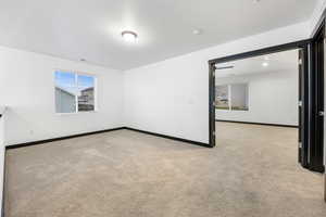 View of carpeted spare room