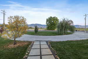 View of property's community featuring a mountain view and a yard