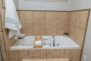 Bathroom with tiled tub