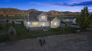 View of front of house featuring a deck with mountain view