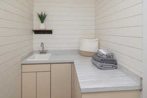 Bathroom with wood walls and vanity