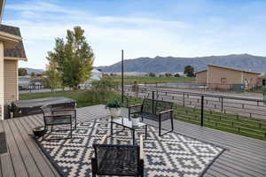 Wooden deck featuring a mountain view