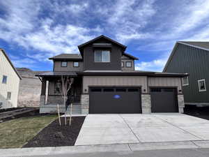 View of front of property with a garage