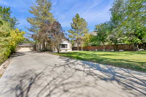 View of front of home featuring a garage and a front yard