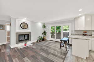 Interior space featuring hardwood / wood-style flooring and crown molding