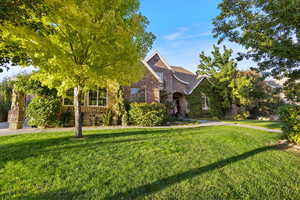 View of front of property with a front lawn