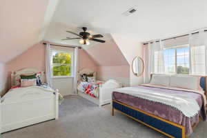 Bedroom featuring vaulted ceiling, ceiling fan, and light colored carpet