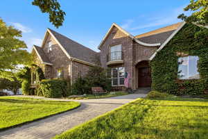 Tudor house featuring a front yard