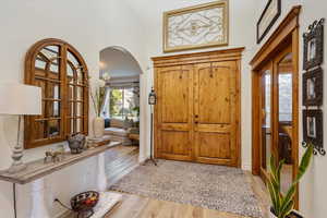 Foyer entrance with light hardwood / wood-style floors