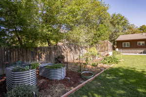 View of yard with a storage unit