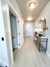 Hallway featuring light hardwood / wood-style flooring