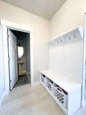 Mudroom featuring light wood-type flooring