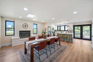 Spacious Dining with Fireplace and skylight