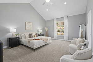 Bedroom with light carpet, high vaulted ceiling, and ceiling fan