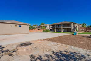 View of yard with a patio and an outdoor fire pit