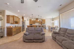 Living room featuring sink, a chandelier, and light tile patterned floors