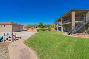 View of yard featuring a garage