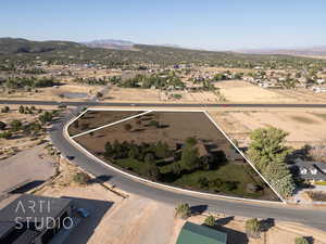 Birds eye view of property featuring a mountain view