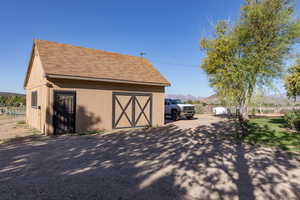 View of outbuilding with a mountain view