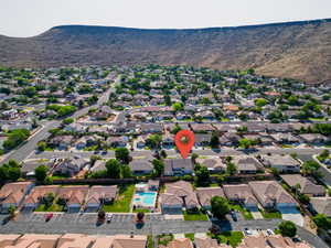 Birds eye view of property with a mountain view