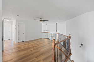 Unfurnished room featuring wood-type flooring and ceiling fan