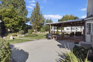 View of patio with a wooden deck