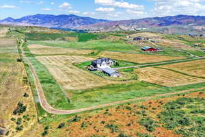 Drone / aerial view with a mountain view and a rural view