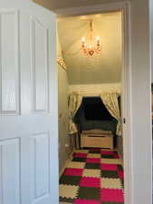 Little playroom featuring a notable chandelier