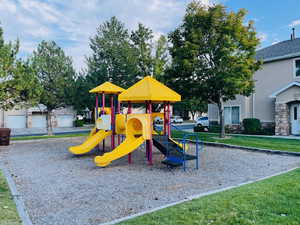 View of jungle gym with a yard