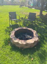 View of yard with a fire pit