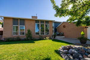 Front view of house with a lawn and a porch