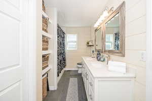 Owner's Bathroom with a textured ceiling, vanity, and toilet